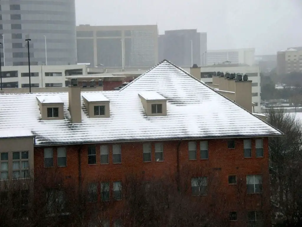 Snow building up on a roof.