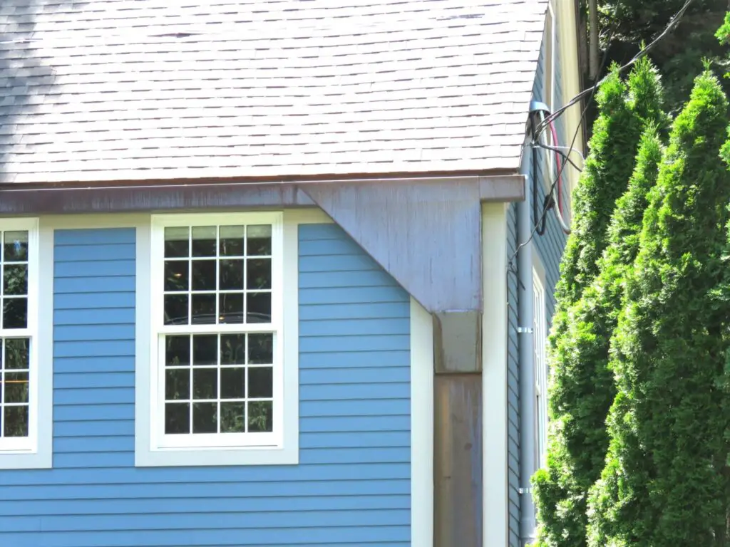 A very large, custom-made copper conductor head used as an architectural highlight on a house.