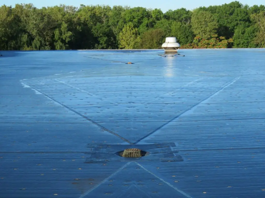 Roof crickets between the drains on an EPDM roof.