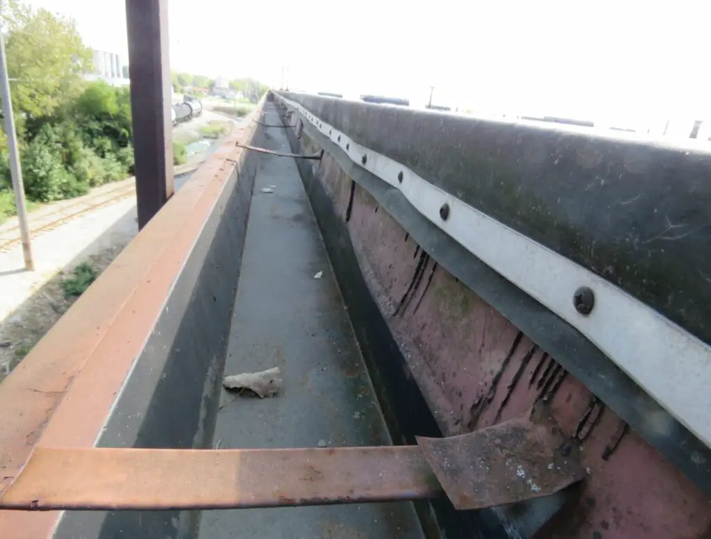 A steel gutter system on an EPDM low-slope commercial roof.