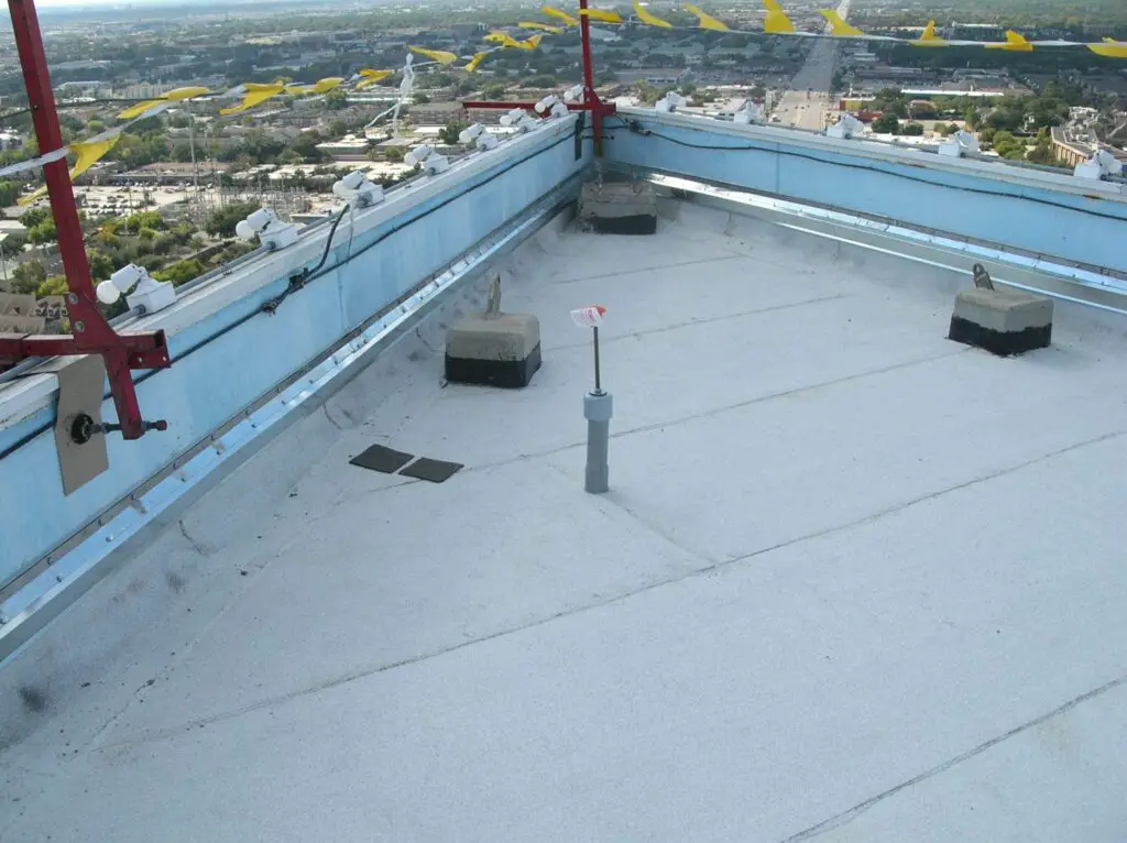 Newly installed modified bitumen roofing on a roof 20 stories high.