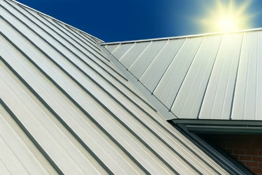 Silver-colored standing seam metal roofing under a bright sun.