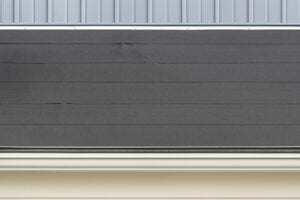 Roll roofing as installed on a shed roof at the back of a restaurant.