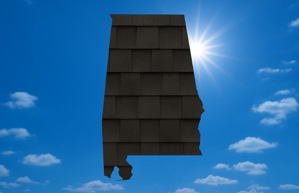 Outline of the State of Alabama filled in with an image of asphalt shingles, set against a background of blue sky with clouds and sun.