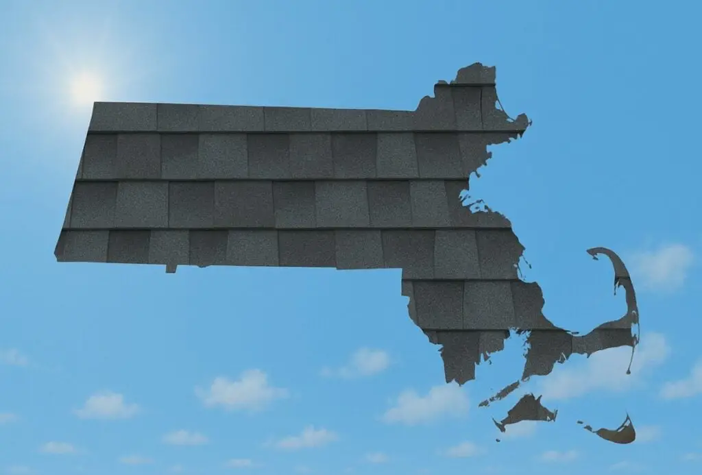 Outline of the State of Massachusetts filled in with an image of roofing slates, set against a background of blue sky with clouds and sun.