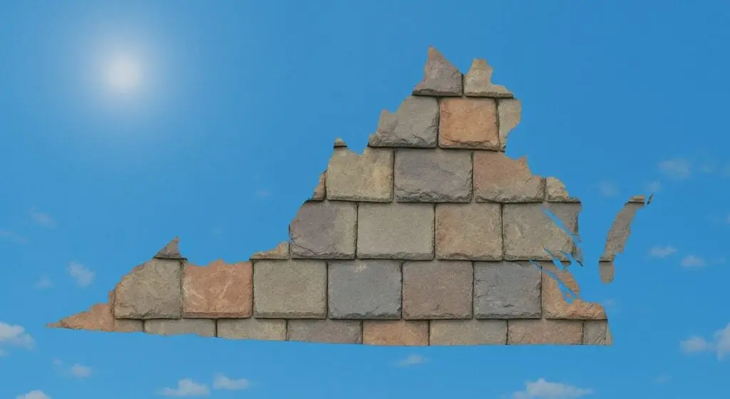 Outline of the State of Virginia filled in with an image of roofing slates, set against a background of blue sky with clouds and sun.