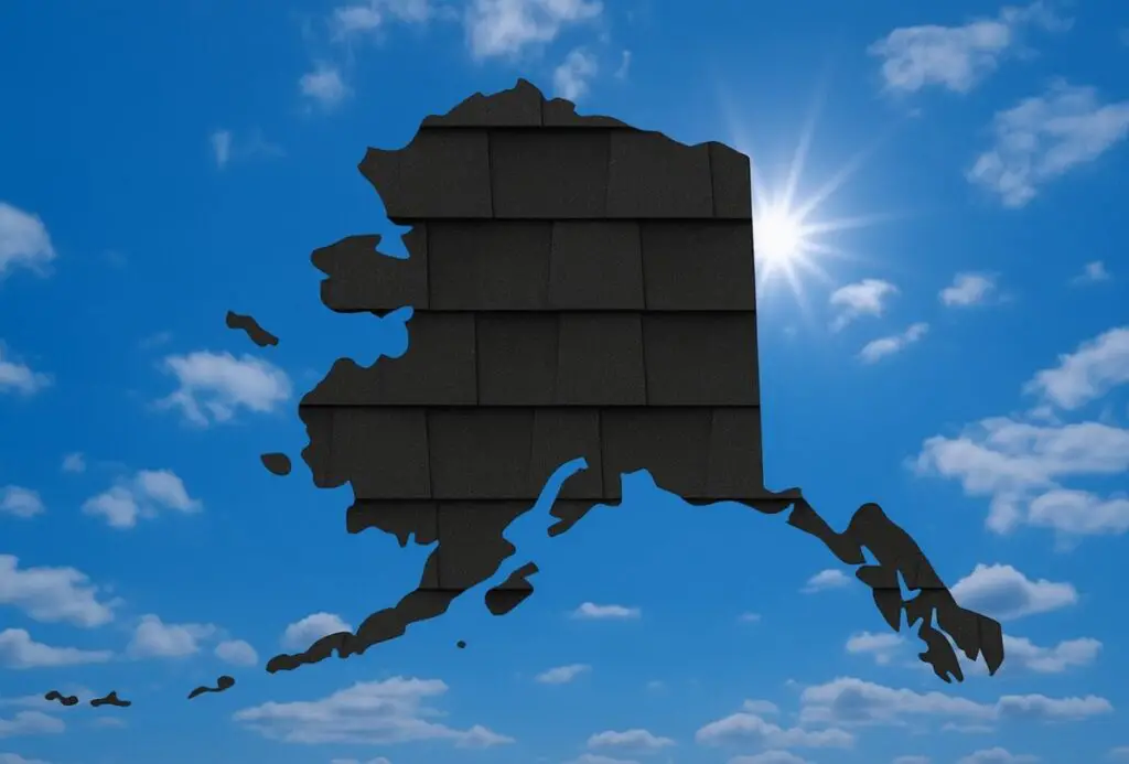 Outline of the State of Alaska filled in with an image of asphalt roof shingles, set against a background of blue sky with clouds and sun.