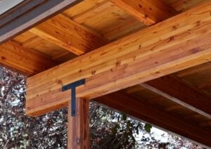 A glulam beam used as a supporting member for an outddor structure.