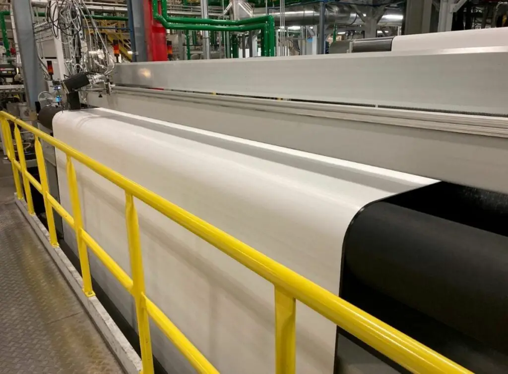 A sheet of white TPO roofing membrane at the factory.